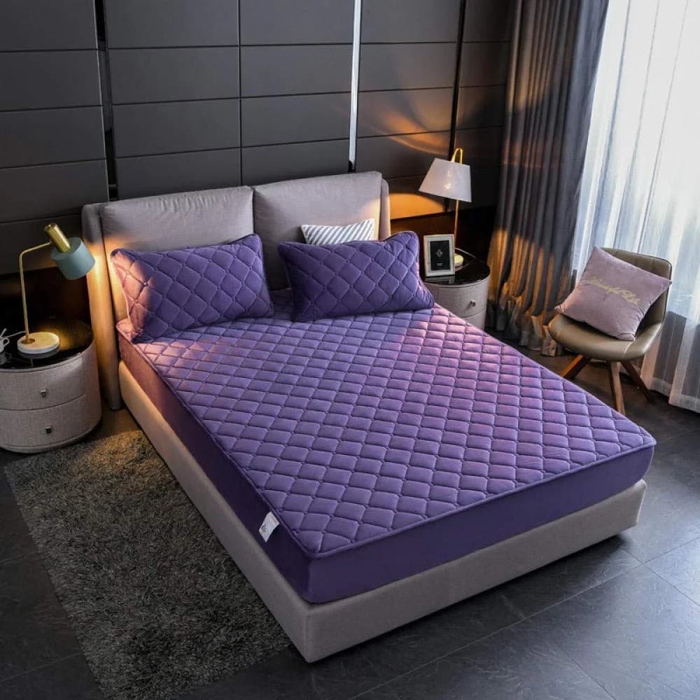 Waterproof mattress protector on a bed
